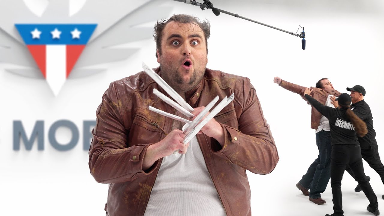 Claw Mobile stunt film thumbnail: a fake Hugh Jackman with cardboard Wolverine claws and a wide-eyed expression in front of the Claw Mobile logo, with security tackling another version of the character on the right